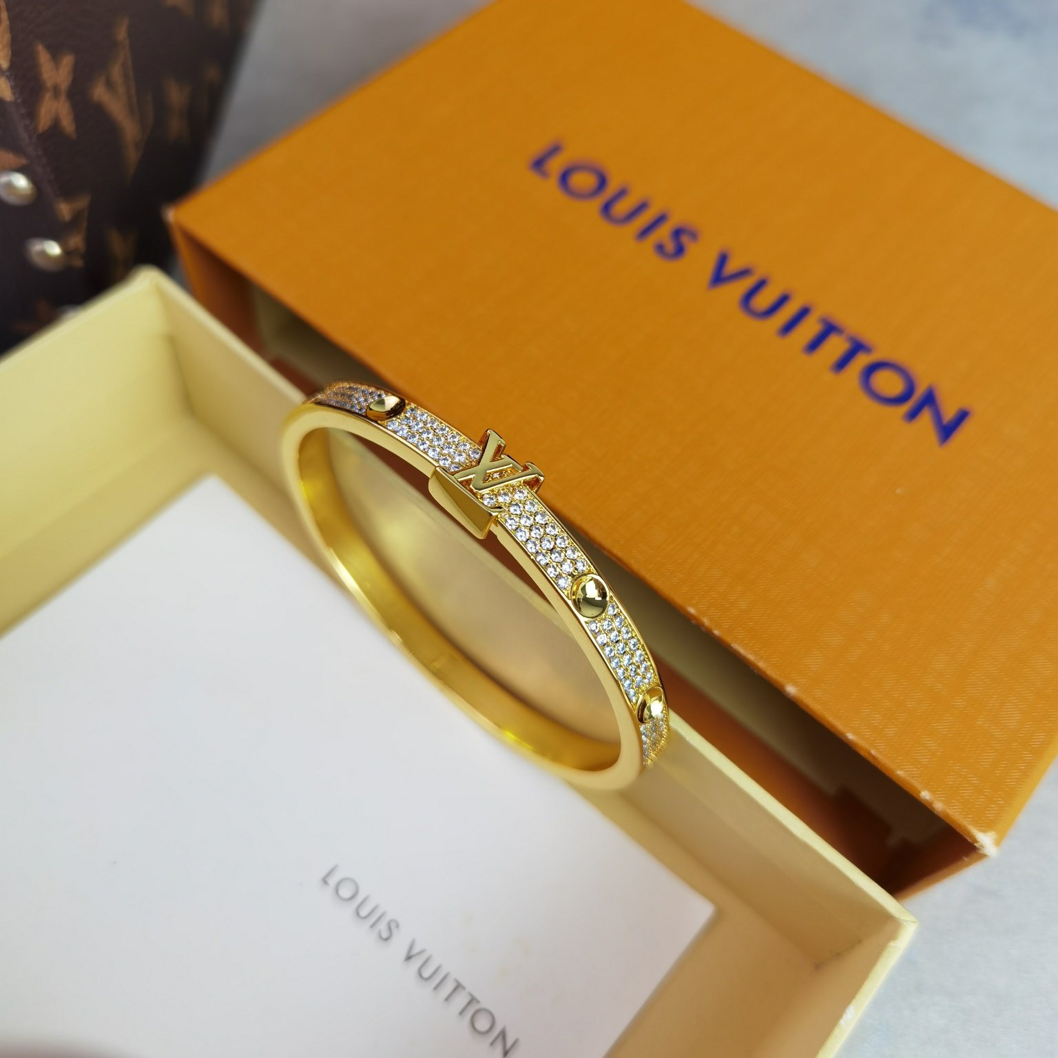 empreinte medium bangle, white gold and diamonds empreinte medium bangle, white gold and diamonds