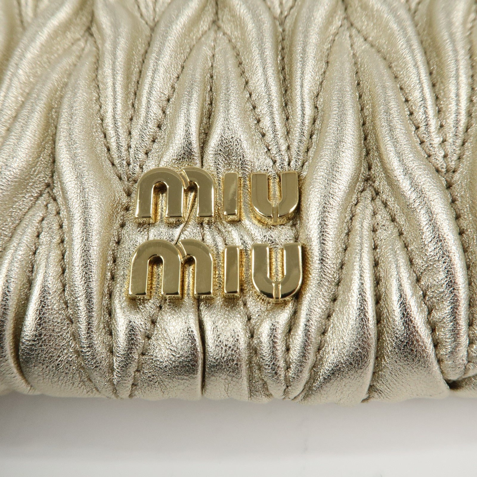 miu miu matelasse leather pouch silk eye mask gold used miu miu matelasse leather pouch silk eye mask gold used
