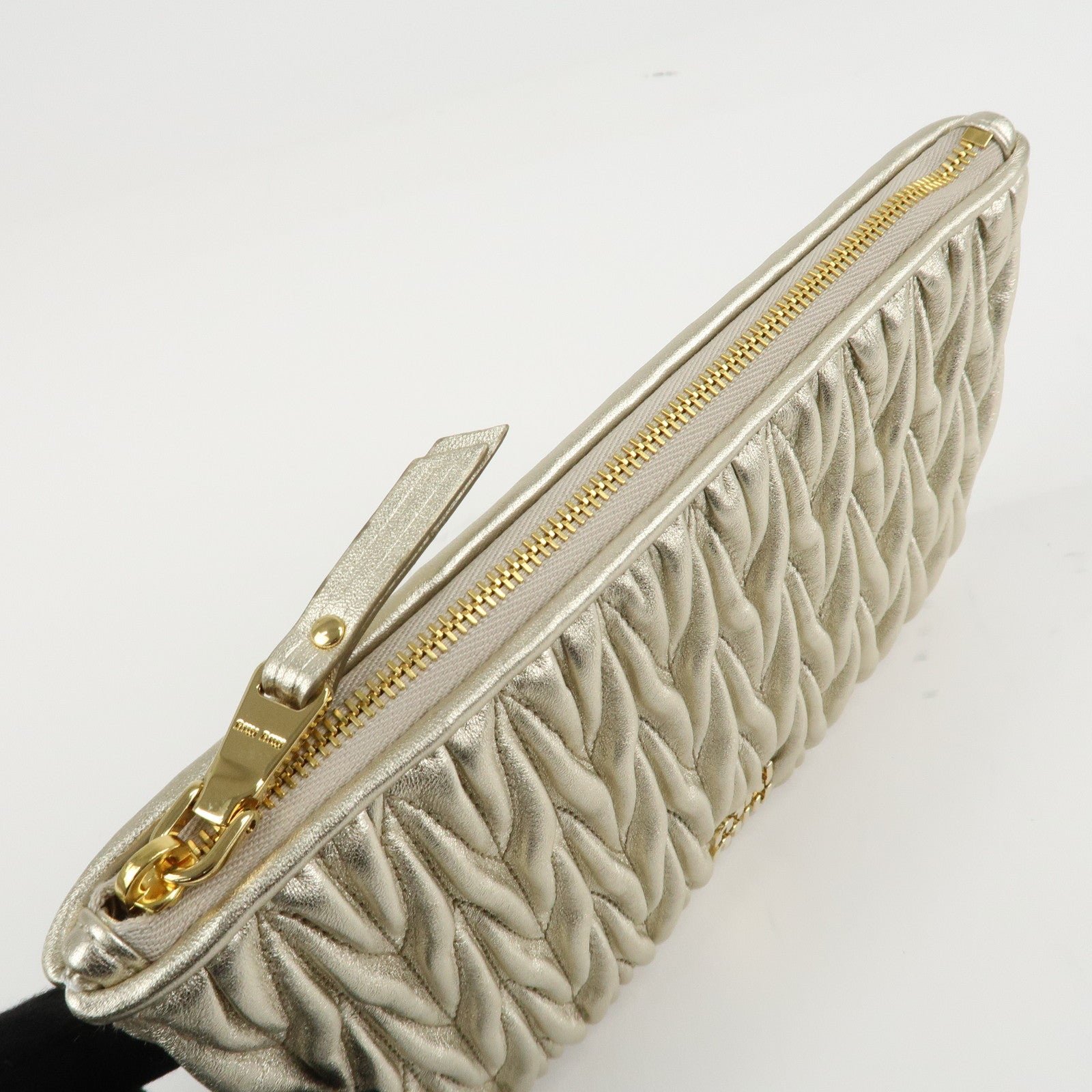 miu miu matelasse leather pouch silk eye mask gold used miu miu matelasse leather pouch silk eye mask gold used