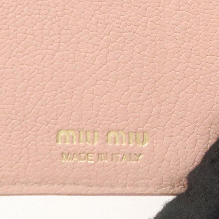 miu miu leather double hook bi fold wallet pink gold hardware used miu miu leather double hook bi fold wallet pink gold hardware used